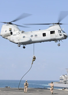 Soldiers fast rope from a CH-46E Sea Knight helicopter onto amphibious transport Soldiers fast rope from a CH-46E Sea Knight helicopter onto amphibious transport