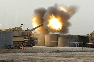 Images Dated 13th March 2007: Soldiers fire the howitzers on their M109A6 Paladins