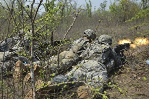 Platoon Gallery: Soldiers fire the M240B machine gun on their objective