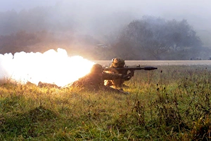 Soldiers fire a rocket propelled grenade at opposing forces Soldiers fire a rocket propelled grenade at opposing forces