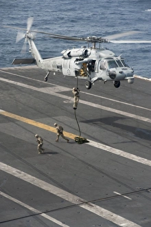 Soldiers rappel from an MH-60S Sea Hawk helicopter Soldiers rappel from an MH-60S Sea Hawk helicopter