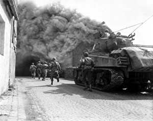 Soldiers move through a smoke filled street, Wernberg, Germany Soldiers move through a smoke filled street, Wernberg, Germany