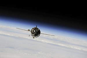 The Soyuz TMA-10M spacecraft in orbit above Earth The Soyuz TMA-10M spacecraft in orbit above Earth