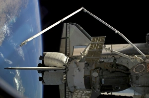 A Soyuz vehicle and the Space Shuttle Discovery docked to the International Space Station A Soyuz vehicle and the Space Shuttle Discovery docked to the International Space Station
