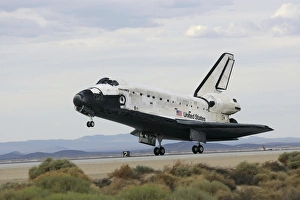 Space Shuttle Discoverys main landing gear touches down for landing Space Shuttle Discoverys main landing gear touches down for landing