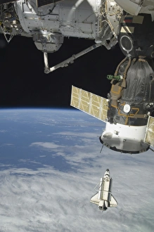 Space shuttle Endeavour, a Soyuz spacecraft, and the International Space Station Space shuttle Endeavour, a Soyuz spacecraft, and the International Space Station