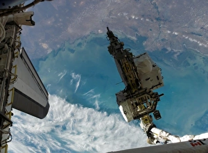 The Space Shuttle Endeavours Remote Manipulator System robotic arm moves an external The Space Shuttle Endeavours Remote Manipulator System robotic arm moves an external