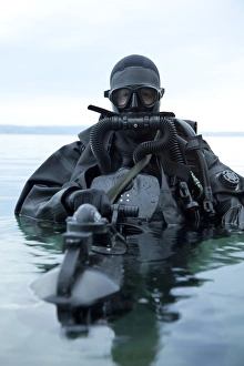 Special operations forces combat diver with underwater propulsion vehicle Special operations forces combat diver with underwater propulsion vehicle