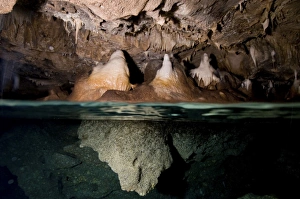 Split shot of stalactites and stalagmites in a cave, Australia Split shot of stalactites and stalagmites in a cave, Australia