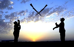 Two Staff Sergeants perform the Overs maneuver while practicing drill for the Base Two Staff Sergeants perform the Overs maneuver while practicing drill for the Base