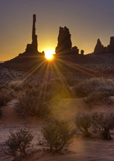 Sunburst through the Totem Pole formation in Monument Valley, Utah Sunburst through the Totem Pole formation in Monument Valley, Utah