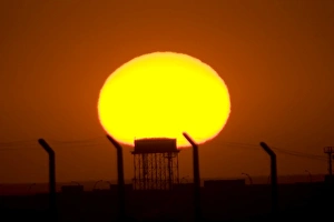 Sunrise over Camp Wolfe with an old Iraqi water tower in the foreground Sunrise over Camp Wolfe with an old Iraqi water tower in the foreground
