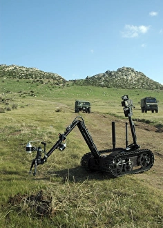 Technicians operate the MK II Talon robot to investigate an improvised explosive device Technicians operate the MK II Talon robot to investigate an improvised explosive device