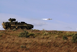 A TOW missile is launched from an armored vehicle A TOW missile is launched from an armored vehicle