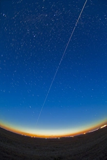 Trail of the International Space Station coming out of the western twilight Trail of the International Space Station coming out of the western twilight