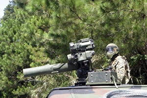 A tube-launched, optically-tracked, wire-guided missile gunner scans for threats A tube-launched, optically-tracked, wire-guided missile gunner scans for threats