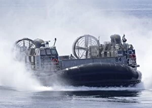 Images Dated 9th April 2012: A U. S. Marine Corps landing craft air cushion transits at high speed