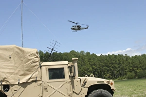 A UH-1N helicopter flies over the Marine Air Support Squadron compound A UH-1N helicopter flies over the Marine Air Support Squadron compound