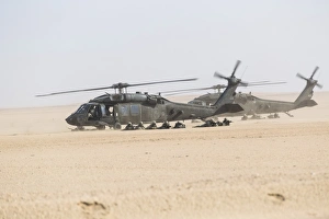 UH-60 Blackhawk helicopters air drop soldiers in Kuwait UH-60 Blackhawk helicopters air drop soldiers in Kuwait