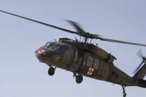 A UH-60 Blackhawk Medivac helicopter flies over Camp Warhorse A UH-60 Blackhawk Medivac helicopter flies over Camp Warhorse