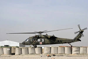 A UH-60 Blackhawk prepares to land at Camp Warhorse to refuel A UH-60 Blackhawk prepares to land at Camp Warhorse to refuel
