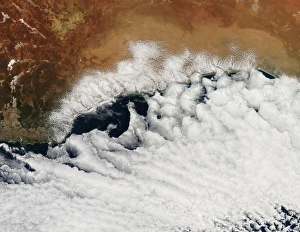 Unusual cloud formations crowd the coastline of Australia Unusual cloud formations crowd the coastline of Australia