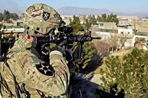 Platoon Gallery: U.S. Army soldier scans for security threats from the rooftop