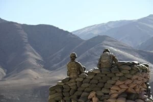 Images Dated 9th January 2011: U.S. Army soldiers run communications equipment from a sandbag bunker in Afghanistan