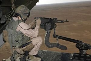 Images Dated 10th November 2007: U.S. Marine test firing an M240 heavy machine gun on the back of a MV-22B Osprey