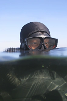 An over under view of a Navy SEAL combat swimmer An over under view of a Navy SEAL combat swimmer