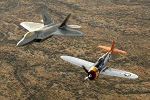 A World War II-era P-47 Thunderbolt and an F-22A Raptor fly in formation A World War II-era P-47 Thunderbolt and an F-22A Raptor fly in formation