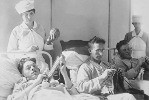 Wounded soldiers knitting under the watchful eye of nurses Wounded soldiers knitting under the watchful eye of nurses