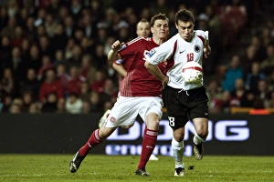 Denmarks Jacobsen fights for the ball with Albanias Hamdi Salihi during their 2010 World Denmarks Jacobsen fights for the ball with Albanias Hamdi Salihi during their 2010 World