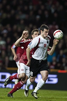 Denmarks Michael Jacobsen and Albanias Hamdi Salihi fight for the ball during their 2010 Denmarks Michael Jacobsen and Albanias Hamdi Salihi fight for the ball during their 2010
