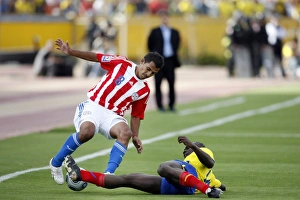 Ecuadors Castillo tackles Paraguays Aquino during their 2010 World Cup qualifying soccer Ecuadors Castillo tackles Paraguays Aquino during their 2010 World Cup qualifying soccer