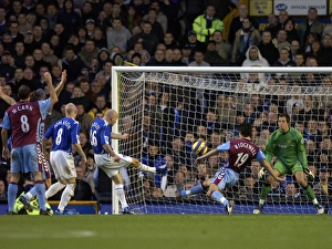 Everton v Aston Villa Lee Carsley - Everton shoots at goal under pressure from Liam Everton v Aston Villa Lee Carsley - Everton shoots at goal under pressure from Liam