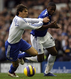 Evertons Anichebe is held back by Chelseas Boulahrouz during their English Premier League Evertons Anichebe is held back by Chelseas Boulahrouz during their English Premier League