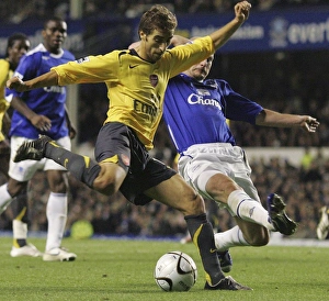 Evertons Carsley challenges Arsenals Flamini for the ball during their English League Cup Evertons Carsley challenges Arsenals Flamini for the ball during their English League Cup