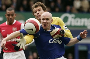 Evertons Johnson challenges Arsenals Lehmann for the ball during their English Premier Evertons Johnson challenges Arsenals Lehmann for the ball during their English Premier