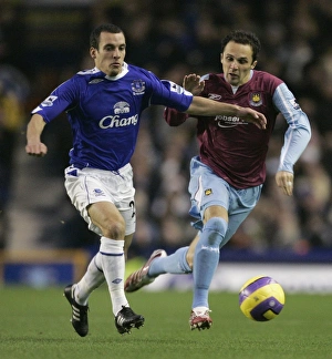 Evertons Osman challenges West Ham Uniteds Etherington for the ball during their English Evertons Osman challenges West Ham Uniteds Etherington for the ball during their English