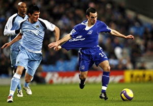 Manchester City v Everton Evertons Leon Osman and Manchester Citys Stephen Jordan Manchester City v Everton Evertons Leon Osman and Manchester Citys Stephen Jordan
