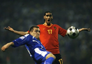 Marouane Fellaini-Bakkioui of Belgium reacts as Boris Pandza of Bosnia kicks the ball Marouane Fellaini-Bakkioui of Belgium reacts as Boris Pandza of Bosnia kicks the ball