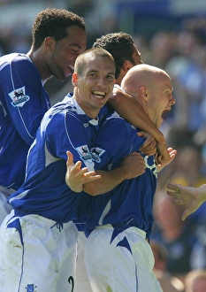 <b class=qtipBold><figcaption>Team Celebration</figcaption></b><br>Andy Johnson is congratulated.<br><em>© Everton</em> Team Celebration