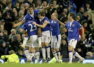 Images Dated 6th December 2009: Tim Cahill's Double: Everton's Victory Moment vs. Tottenham in Premier League