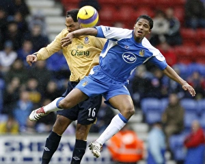 Wigan Athletics Valencia challenges Evertons Lescott for the ball during their English Wigan Athletics Valencia challenges Evertons Lescott for the ball during their English