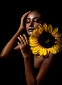 Closed Eyes Gallery: Women with sun flower