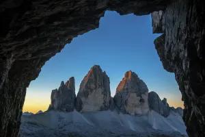 Prints of Tre Cime di Lavaredo / Drei Zinnen, three distinctive mountain peaks in the Sexten Dolomites seen from WW1 cave shelter, South Tyrol, Italy, October 2019 World War I And II Prints: Tre Cime di Lavaredo Mountain Peaks Print