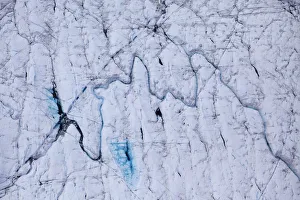 Aerial view of meltwater channels in ice cap north-east of Sermeq Kujalleq Glacier Aerial view of meltwater channels in ice cap north-east of Sermeq Kujalleq Glacier