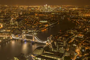 Aerial view of River Thames and Tower Bridge in London at night. October 2014 Aerial view of River Thames and Tower Bridge in London at night. October 2014