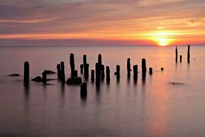 Images Dated 9th June 2008: Baltic sea with posts sticking out of water at sunset, Latvia, June 2009